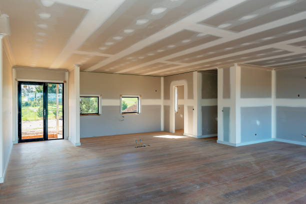 Residential home interior with plasterboard and newly laid timber flooring Entreprise d'aménagement intérieur à Lille